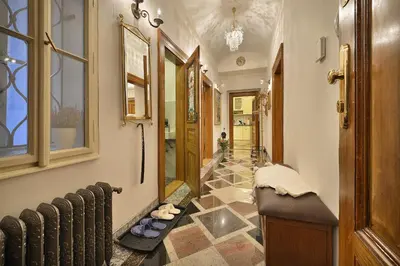 a hallway with a walkway with a hallway at Apartman Dalia Janáčkovo nábřeží in Prague