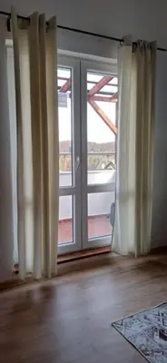 a living room with a couch and a table at Apartmán ,,Rokytka