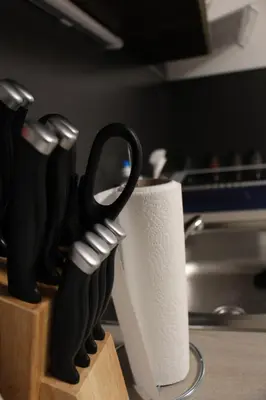 a knife block and a roll of paper towels at Apartments Praha Jinonice in Prague