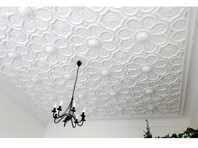 a chandelier hanging from a white ceiling at Apartments Katarina in Prague