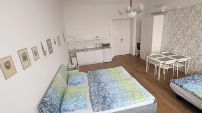 a living room with a couch and a table at Apartments Katarina in Prague