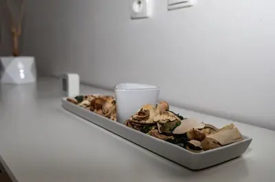 a plate of food on a table with a cup at Richie Apartment near Aquapark in Prague