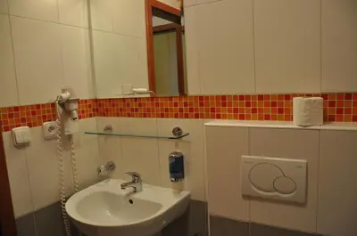 a bathroom with a sink and a mirror at City Central De Luxe in Prague