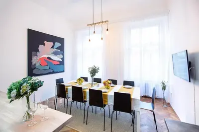 a dining room with a table and chairs at 5BR 2BATH family APT 5mins to Wenceslas square in Prague