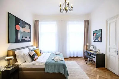 a bedroom with a bed and a desk in it at 5BR 2BATH family APT 5mins to Wenceslas square in Prague