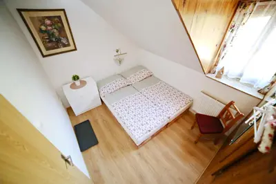 an overhead view of a bedroom with a bed and a window at Restaurace a pension Chalupa in Vorder Třebau