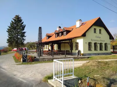 a building with a gate in front of it at Restaurace a pension Chalupa in Vorder Třebau