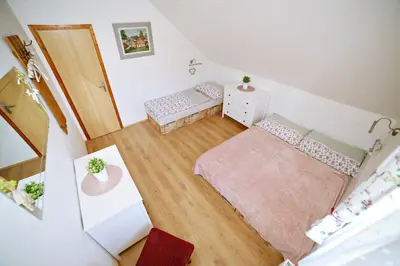 an overhead view of a room with a bedroom at Restaurace a pension Chalupa in Vorder Třebau