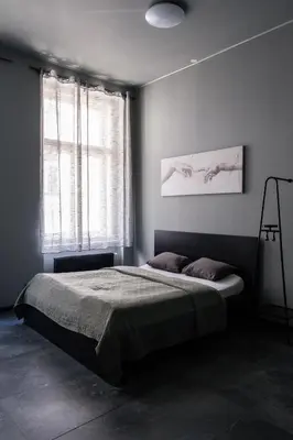 a bedroom with a bed and a window at Wellness Rooms Central in Prague