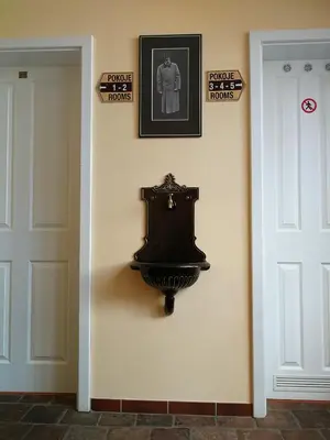 a wall with a picture of a toilet on a wall at Apartments U Švejků in Prague