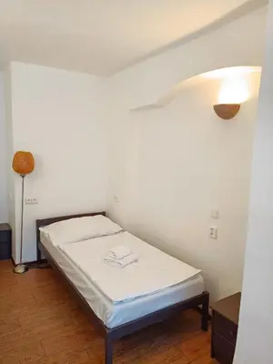 a small bedroom with a bed in a room at Charles Bridge Hostel & Apartments in Prague