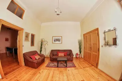 a living room with a couch and a table at Hostel HOMEr - Old Town Square in Prague