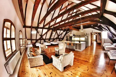 a large room with chairs and tables in a building at Hostel HOMEr - Old Town Square in Prague