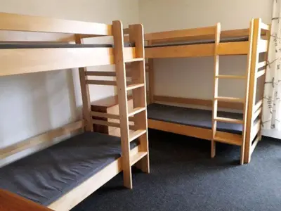 a room with three bunk beds in a room at Hostel Příběh in Týnec nad Sázavou