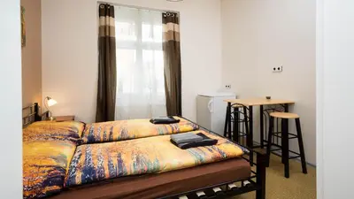 a living room with a couch and a table at Apartment Four Year Seasons - WALKABLE TO CENTRE, METRO AND RIVERSIDE in Prague