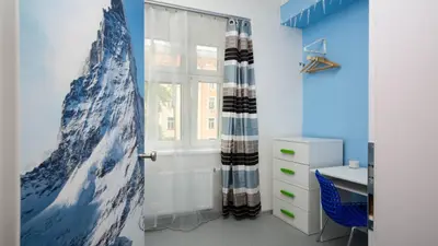 a room with a door with a mountain mural on the wall at Apartment Four Year Seasons - WALKABLE TO CENTRE, METRO AND RIVERSIDE in Prague