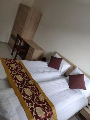 a bedroom with two beds with pillows on them at Sun-House Pension - ParkingFree Limited spaces- in Prague