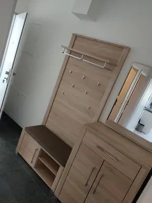 a closet with a wooden door and a mirror at Sun-House Pension - ParkingFree Limited spaces- in Prague