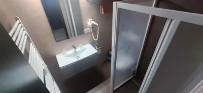 a bathroom with a sink and a mirror at Sun-House Pension - ParkingFree Limited spaces- in Prague
