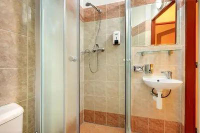 a bathroom with a shower and a sink at Basement Room Old Town in Prague