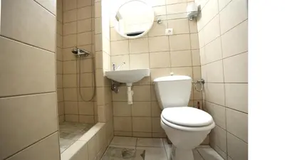 a bathroom with a toilet and a sink at Apartment Kahoun in Prague