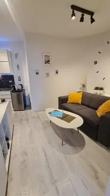 a living room with a couch and a coffee table at Apartment near Congress Centre I. in Prague