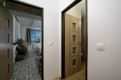 a hallway with a mirror in a room at Apartmány Caffe & Grill in Roudnice nad Labem