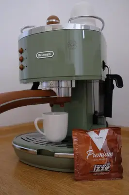 a coffee maker with a cup on a table at Pawlansky Residence in Prague