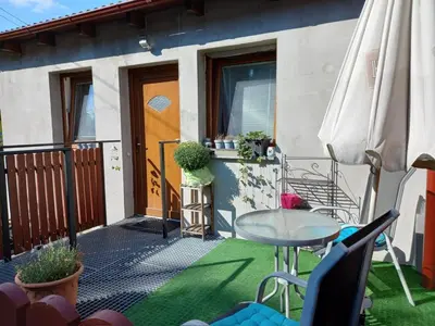 a patio with a table and an umbrella at App Tony Beroun in Beroun