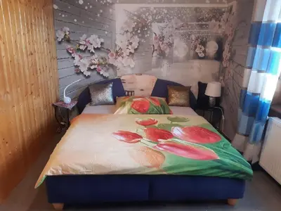 a bedroom with a bed with flowers on it at App Tony Beroun in Beroun