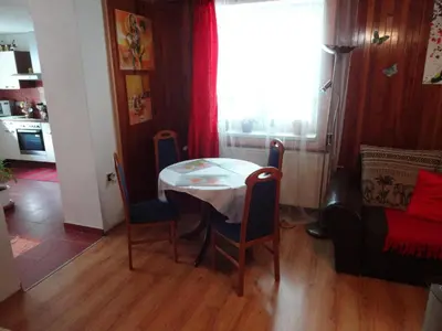 a table and chairs in a kitchen with a window at App Tony Beroun in Beroun