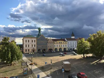 a large building with cars parked in a parking lot at U svaté Ludmily in Litoměřice