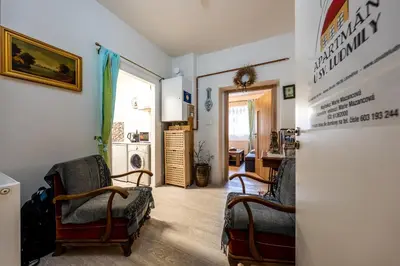 a living room with two chairs and a refrigerator at U svaté Ludmily in Litoměřice