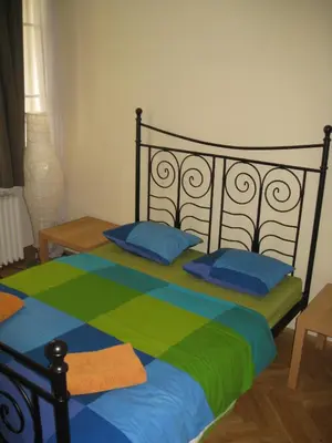 a bedroom with a bed with blue and green at Ragtime in Prague