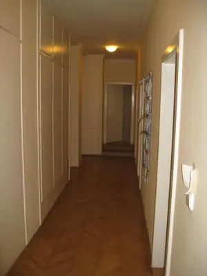 a hallway of an apartment with a long hard wood floor at Ragtime in Prague