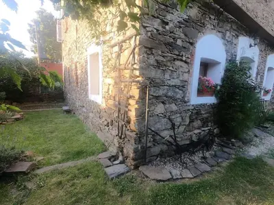 a stone house with a window on the side of it at Bohemia Retreat in Neveklov