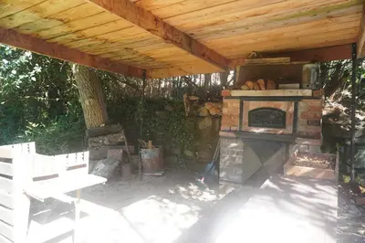 a pizza is cooking in a brick oven at Bohemia Retreat in Neveklov