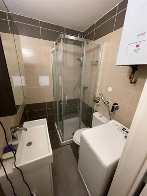 a bathroom with a shower and a toilet and a sink at Prague friendly apartments in Prague in Prague