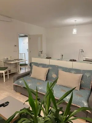 a living room with a couch and a table at FREE PARKING IN GARAGE Karolina Plazza, new cosy studio with all you need in Prague