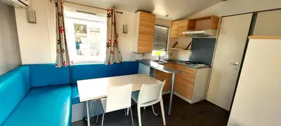 a small kitchen with a table and chairs in it at Triocamp Praha in Prague