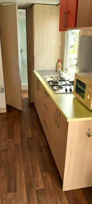 a kitchen with a stove and a counter top at Triocamp Praha in Prague