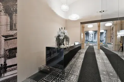 a hallway with a fireplace in a building at Modern Apt with portable AC and Cozy Terrace in Prague