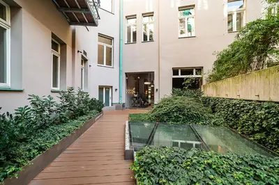 a house with a glass box on a wooden walkway at Modern Apt with portable AC and Cozy Terrace in Prague