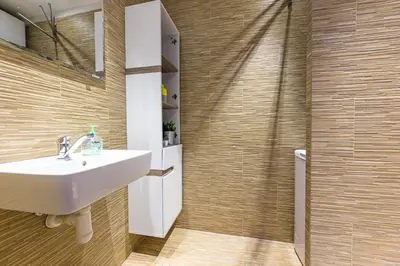 a bathroom with a sink and a shower at Apartments Grebovka in Prague