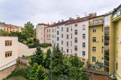 a group of buildings in a city at Apartments Grebovka in Prague