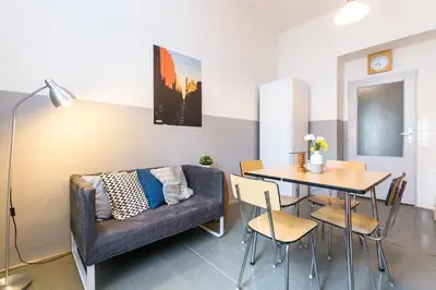 a living room with a couch and a table at Apartments Grebovka in Prague