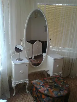 a dressing room with a mirror and a ottoman at Pension Lucie in Prague
