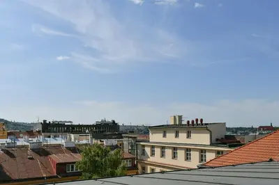 a view of a city with roofs and buildings at LUXURY CENTRAL DUPLEX WITH TERRACE in Prague