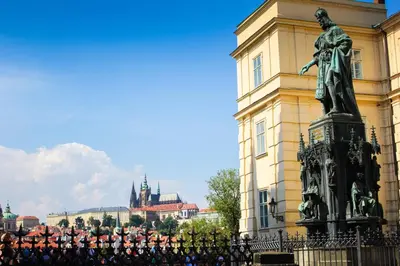 a group of people standing around a statue in front of a building at Art House Apartments by Adrez in Prague