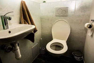 a bathroom with a toilet and a sink at Onefam Míru in Prague